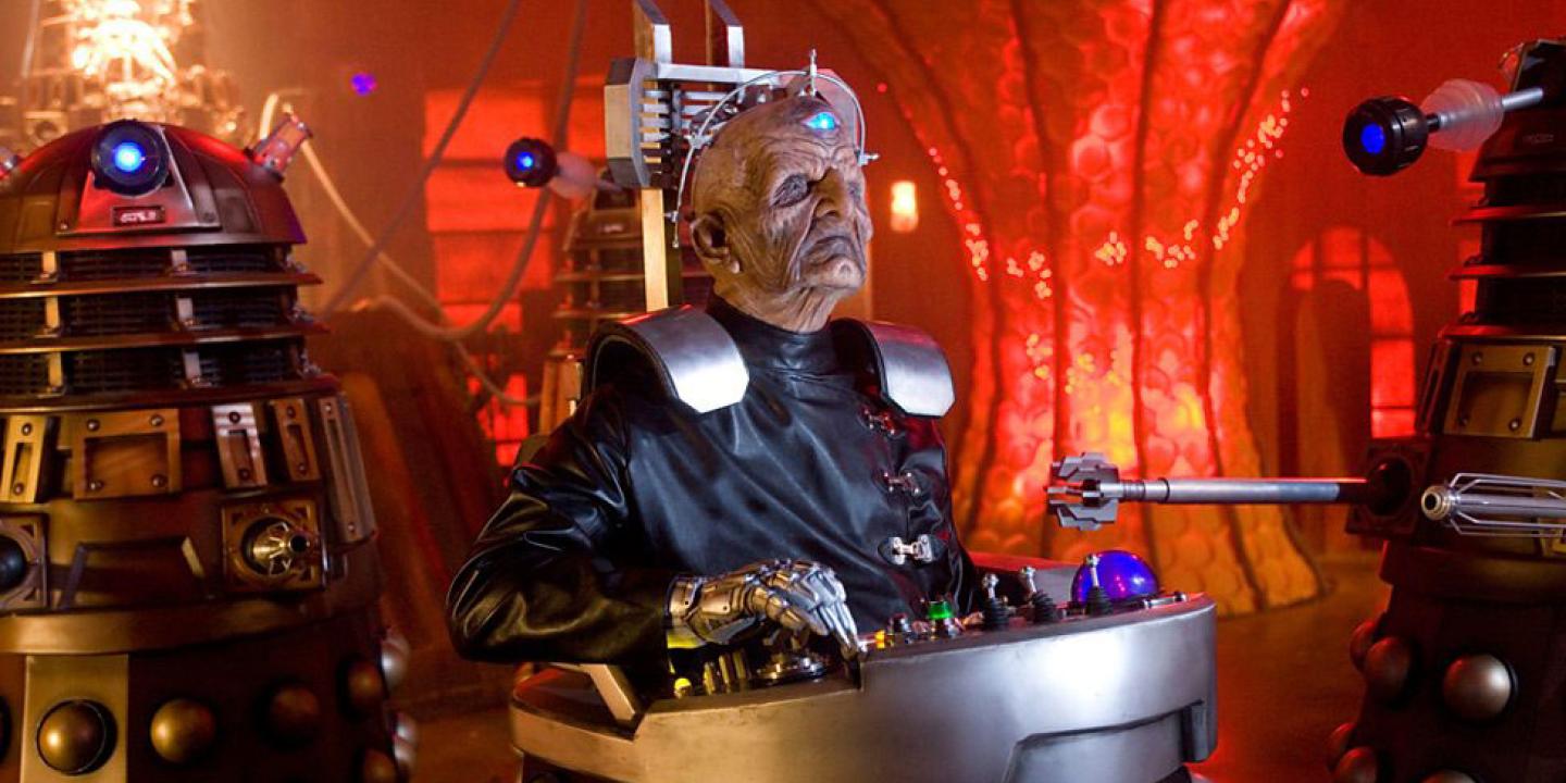 Davros, an alien leader sits in the lower half of a Dalek.