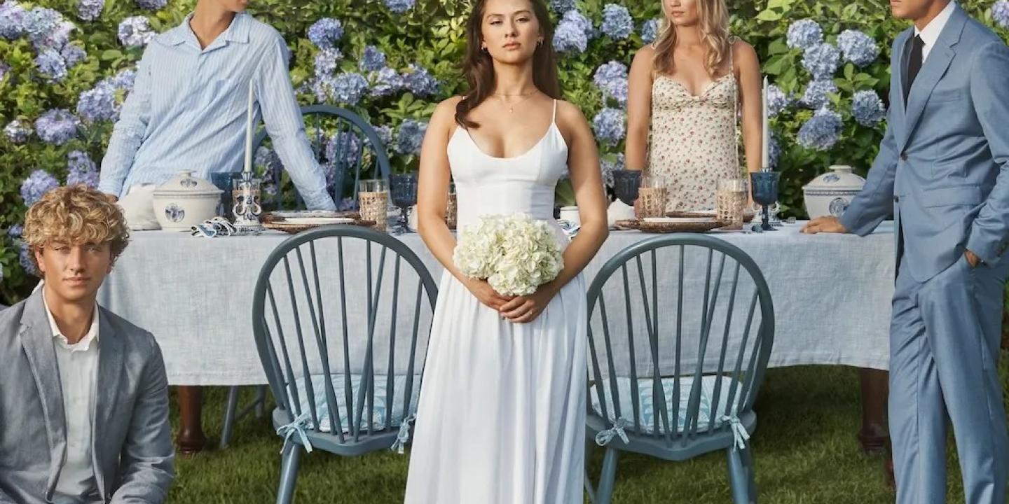 The cast of The Summer I Turned Pretty pose on a wedding set.