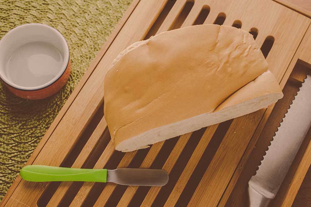 bread a piece of cutlery rest on a breadboard