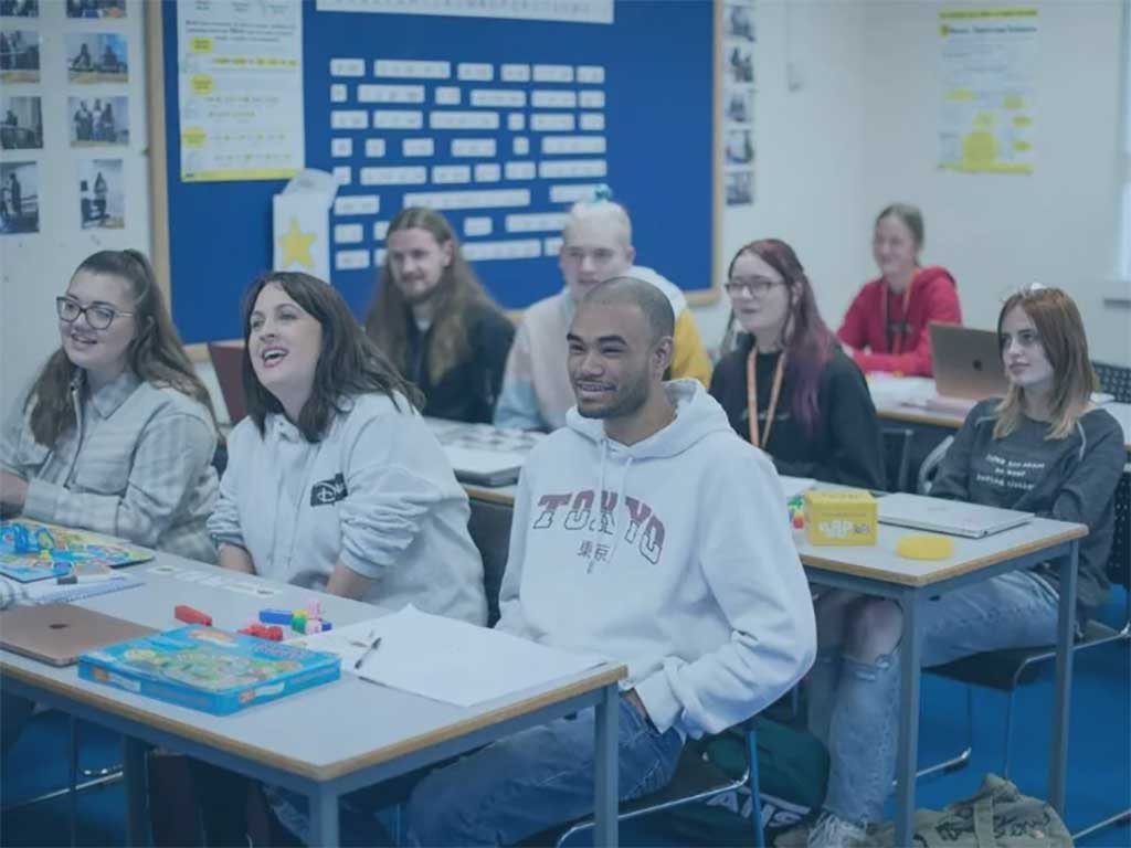 Students sit in a classroom.