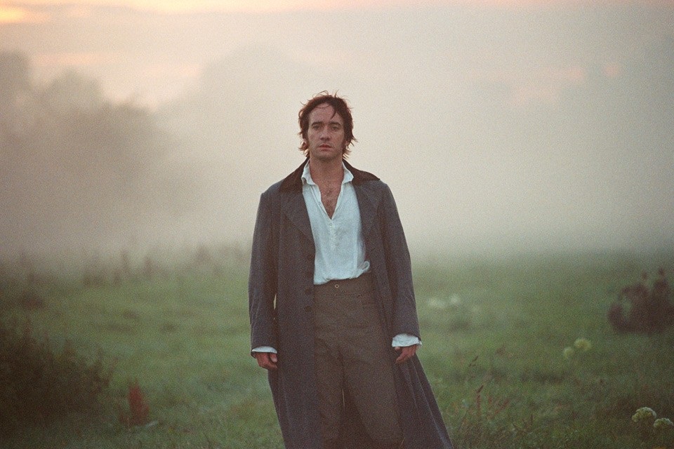 A man dressed in Georgian clothes walks out of the mist.