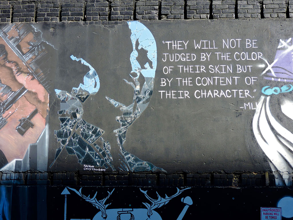 A street mural of Martin Luther King quoting him.