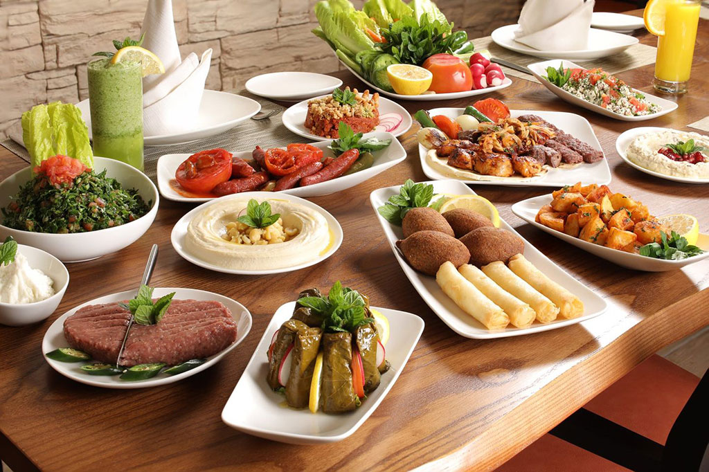 a Lebanese meal of many dishes displayed on a table.