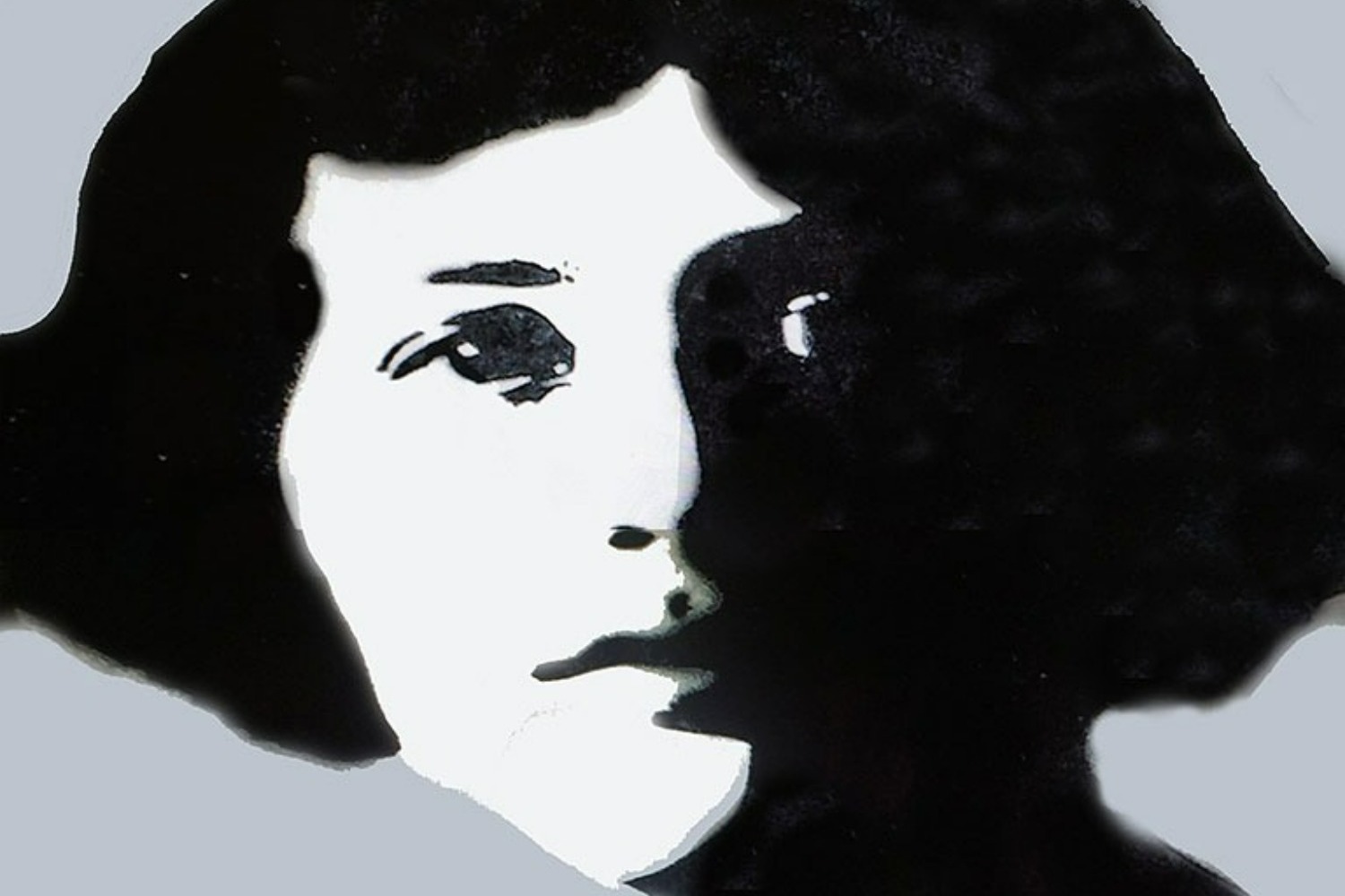 A monotone street mural of a young woman looking fiercely at the viewer.