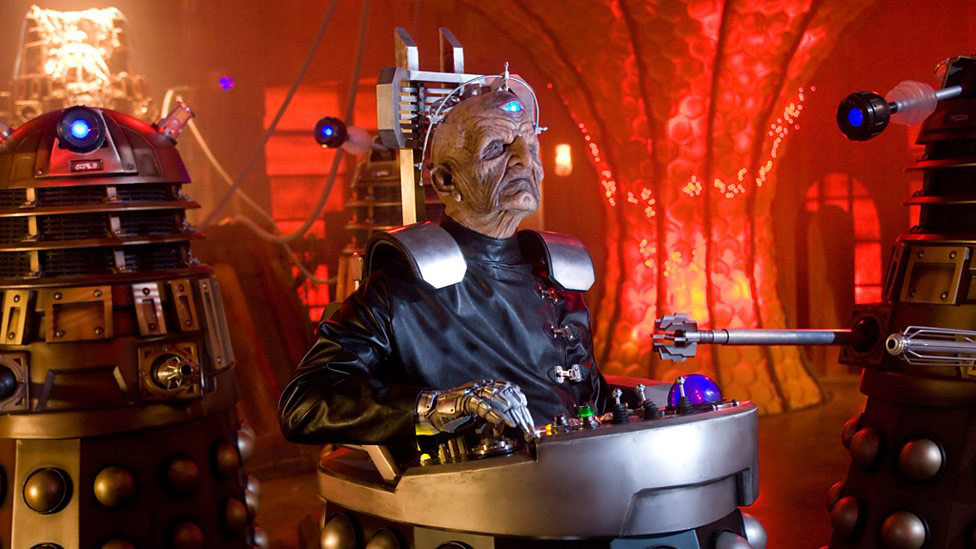 Davros, an alien leader sits in the lower half of a Dalek.