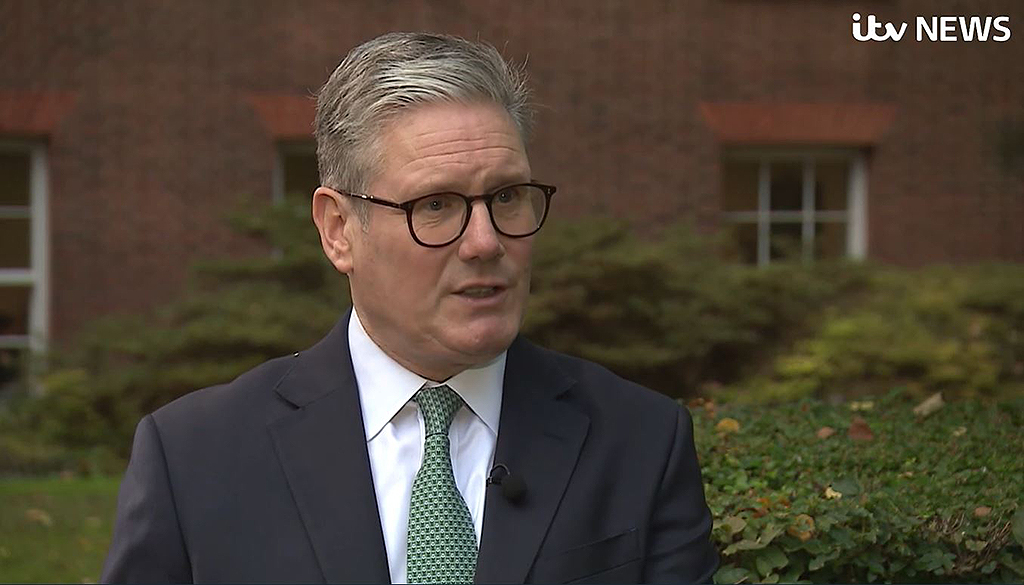 A smartly dressed politician talks while being interviewed