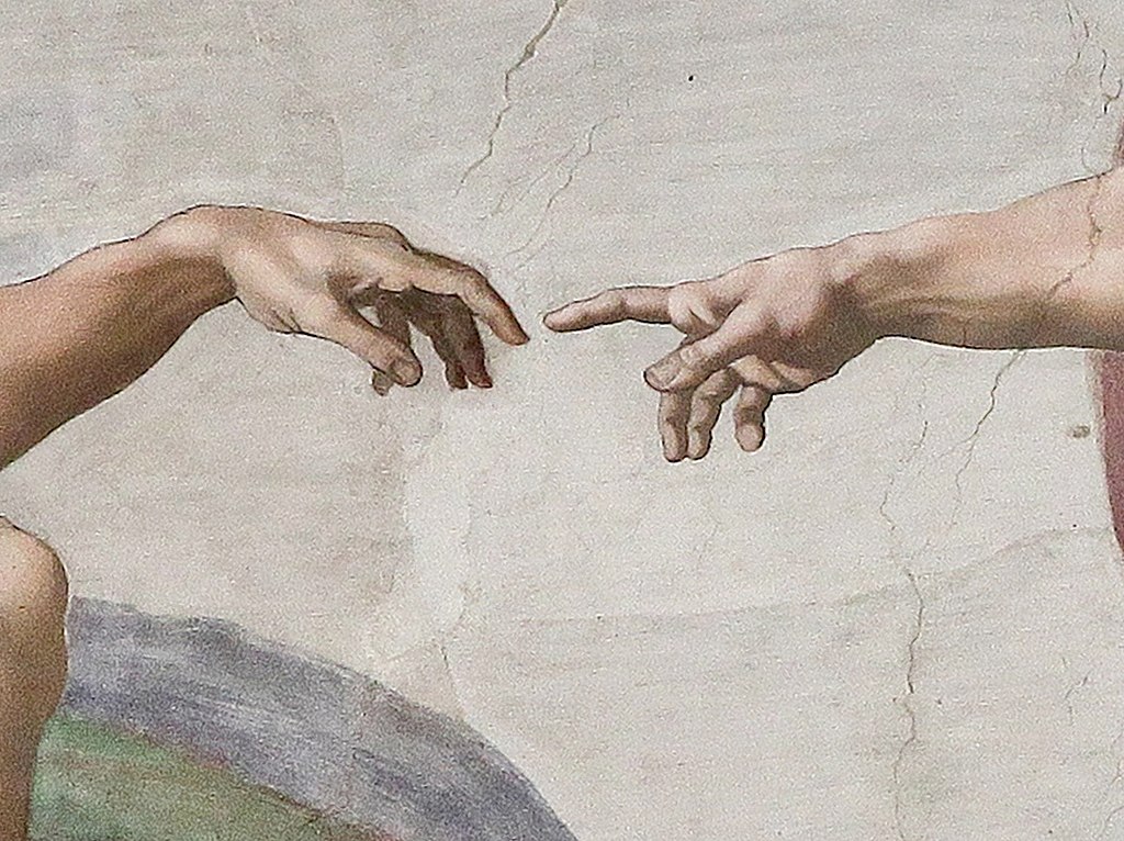 Painting of hand of God touching hand of Adam.