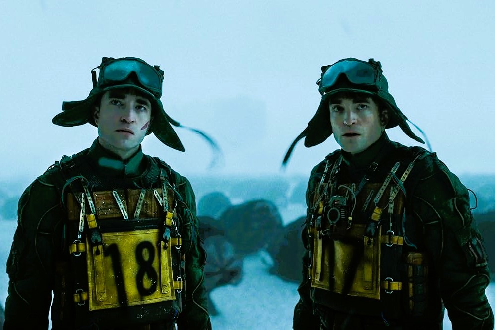 Two cloned humans stand side by side.