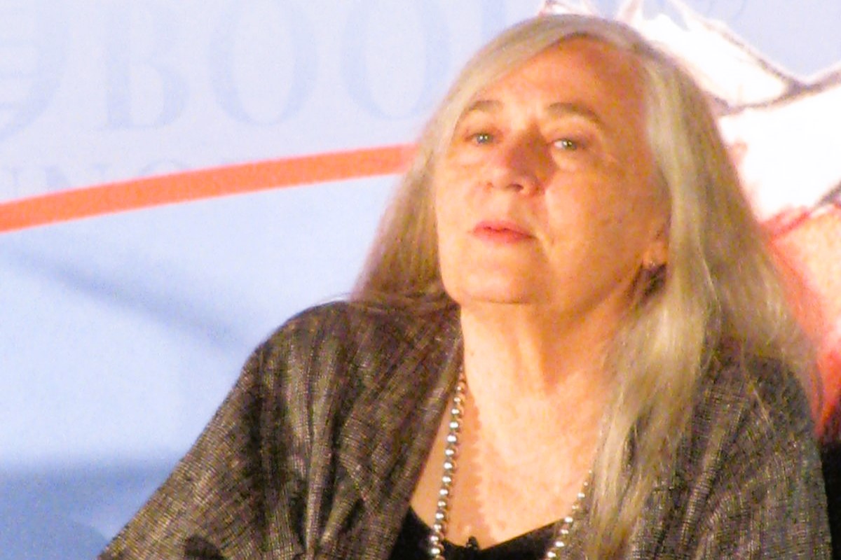 An author sits and listens.