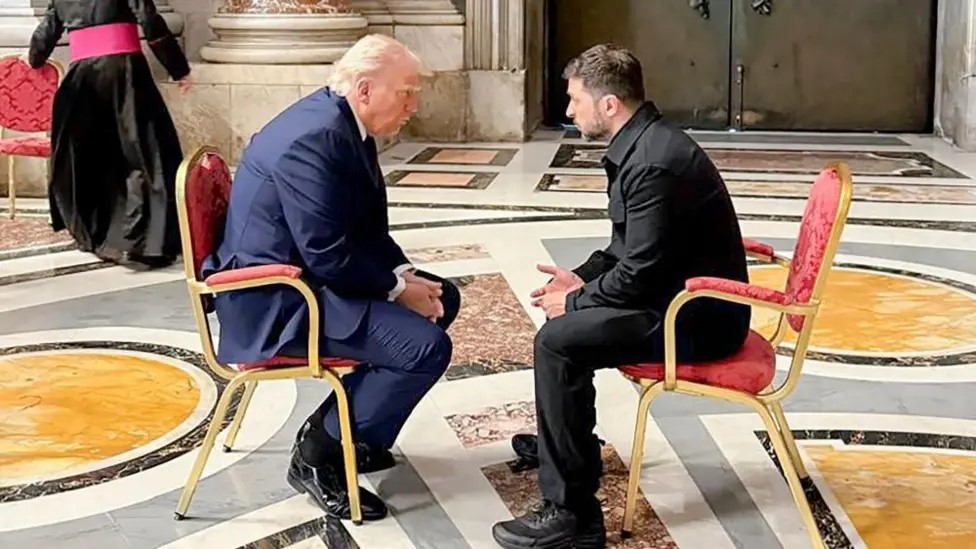 Trump and Zelensky sit and face each other.