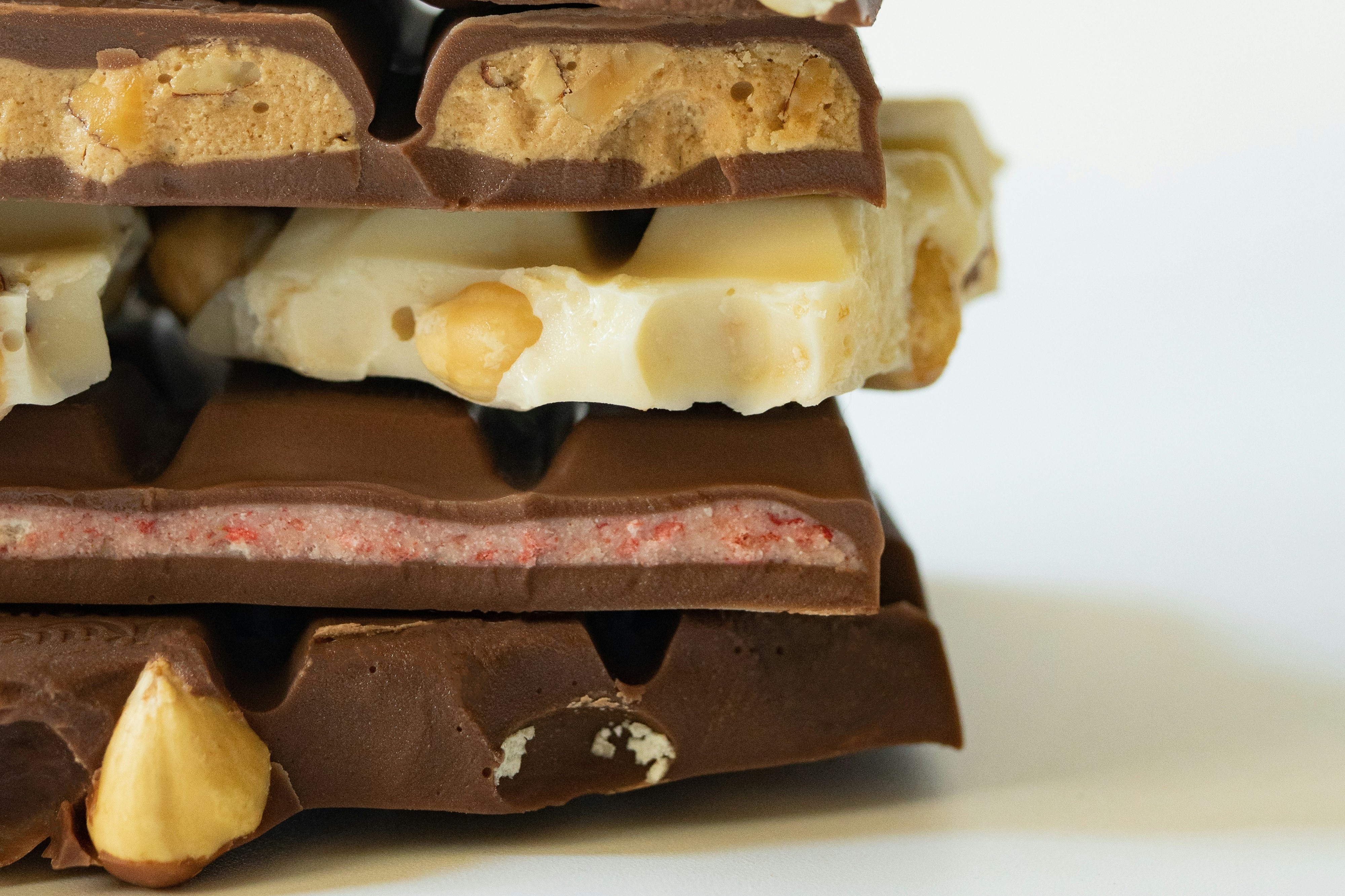 Broken bars of chocolate piled upon each other.
