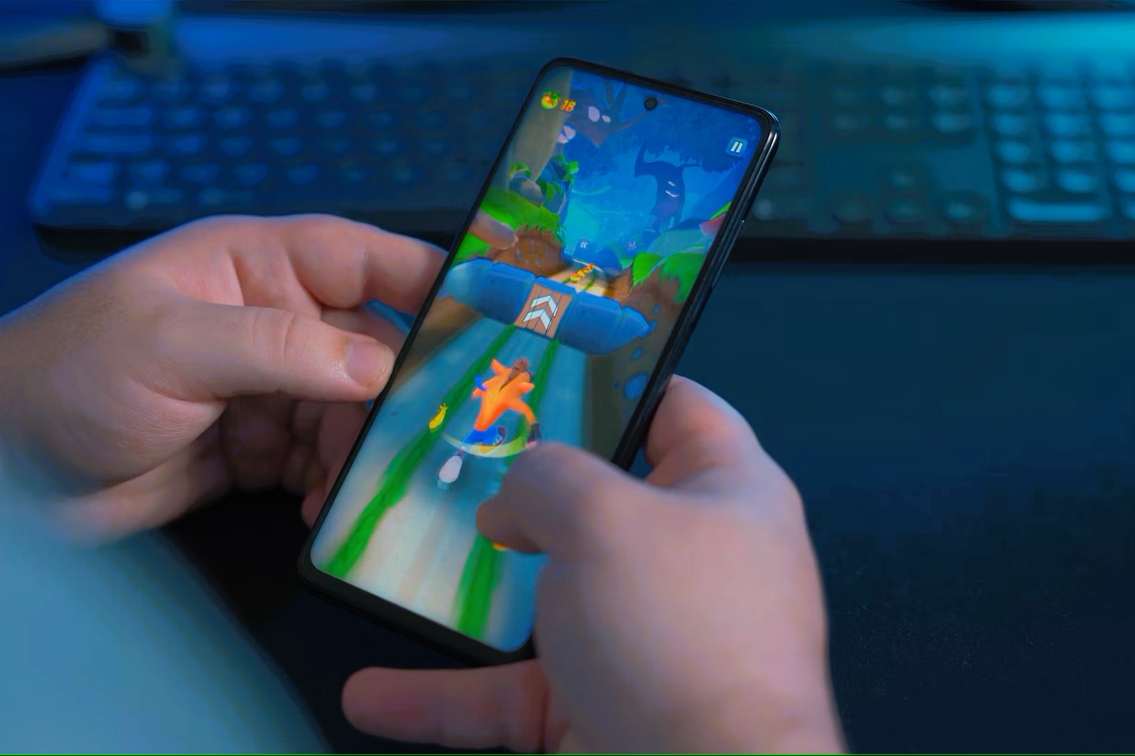 A gamer plays on a phone.