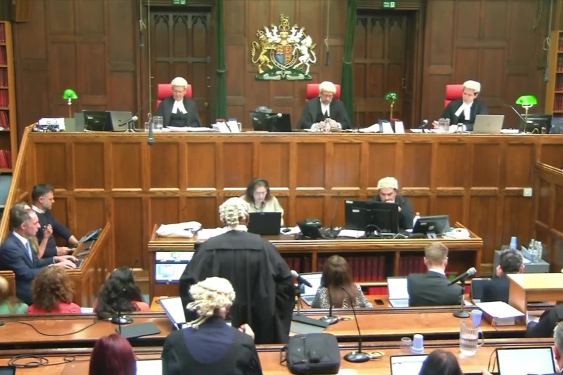 A court sits, with judges raised above the others.