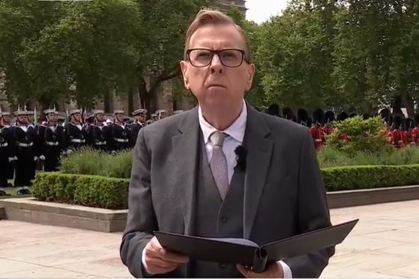An actor reads a speech at a commemoration