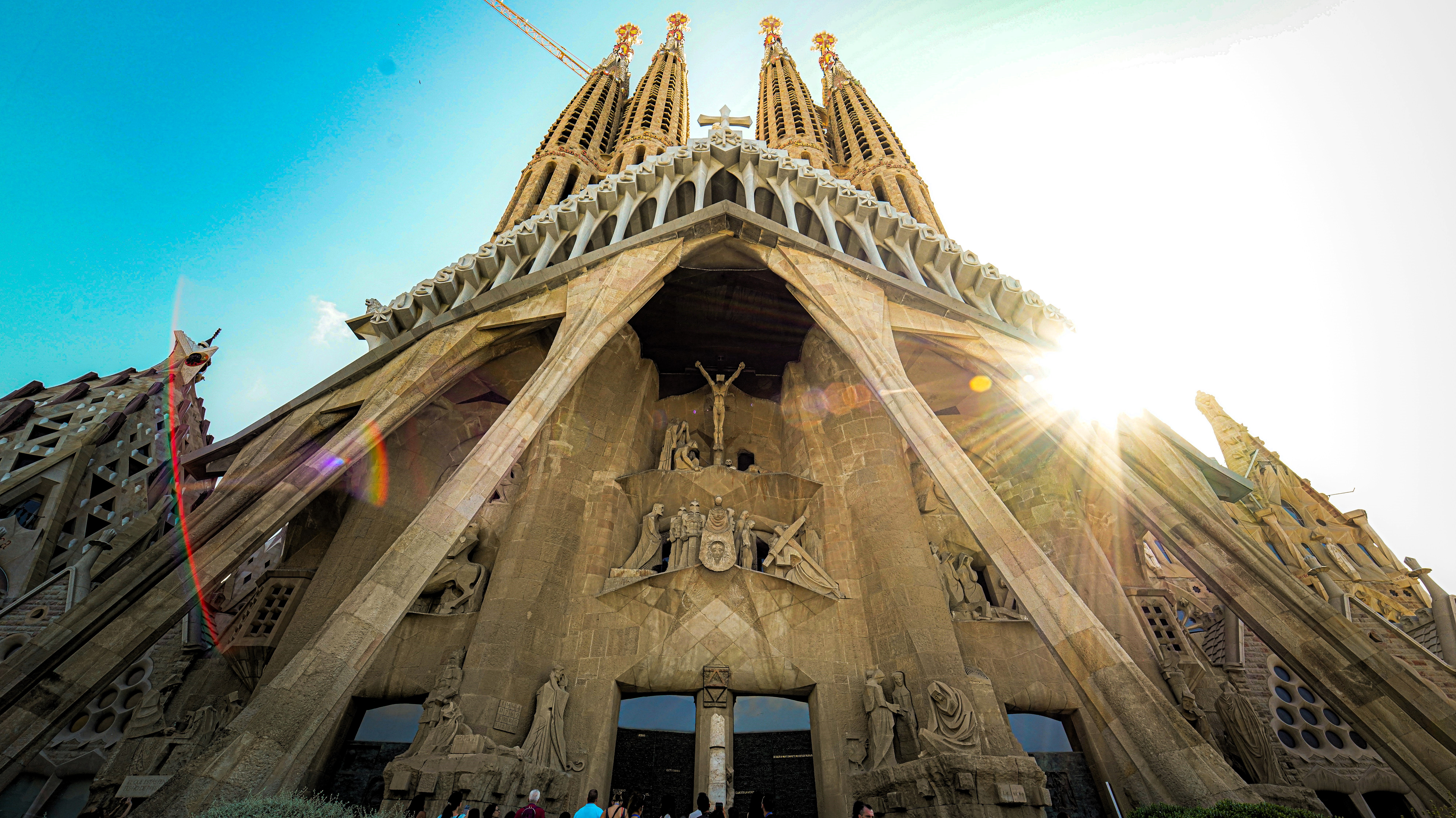 Looking up at the front of Gaudi's cathedra; as the sun comes out from behind the spires.