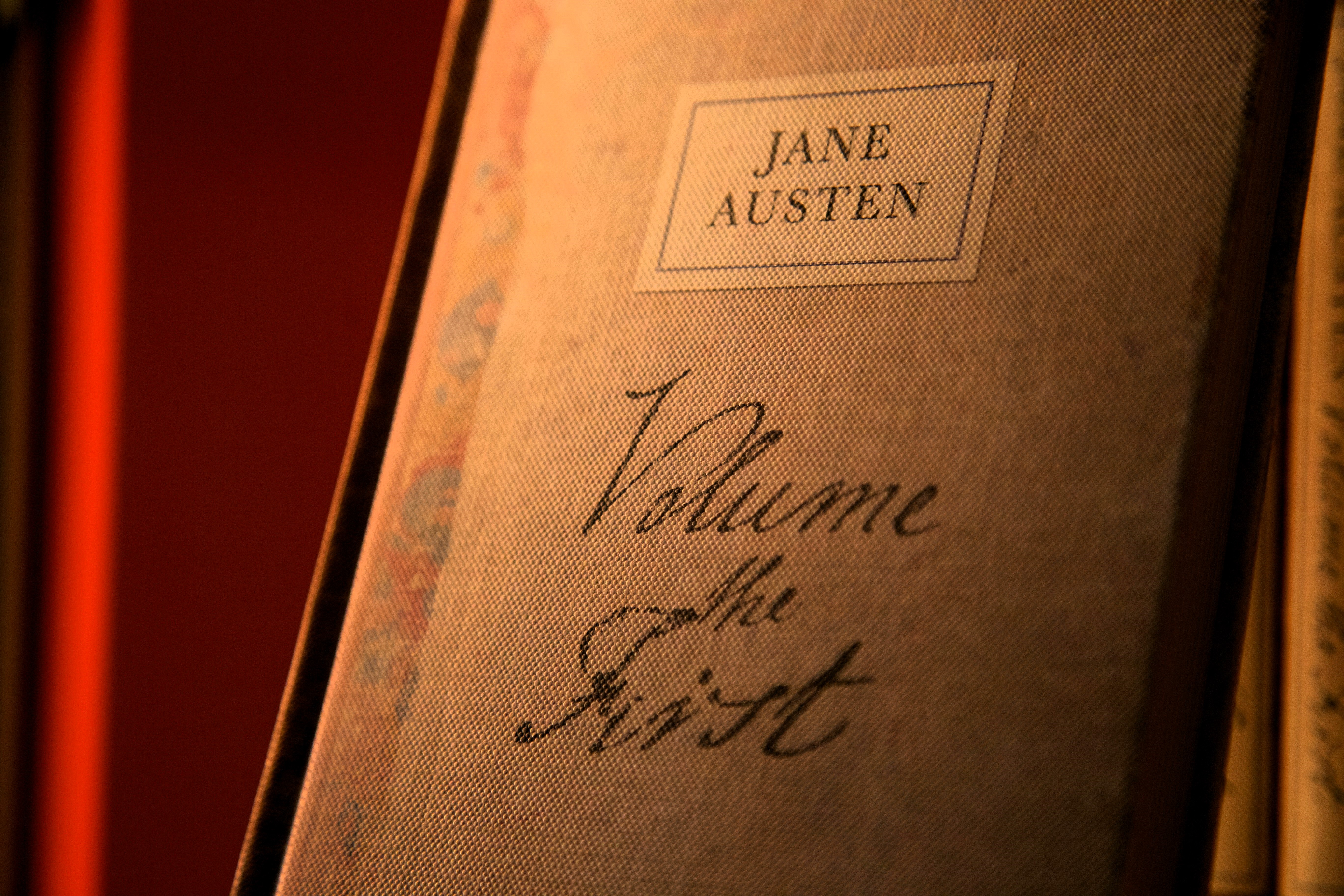 A book cover with a handwritten title that reads: Jane Austen volume the first