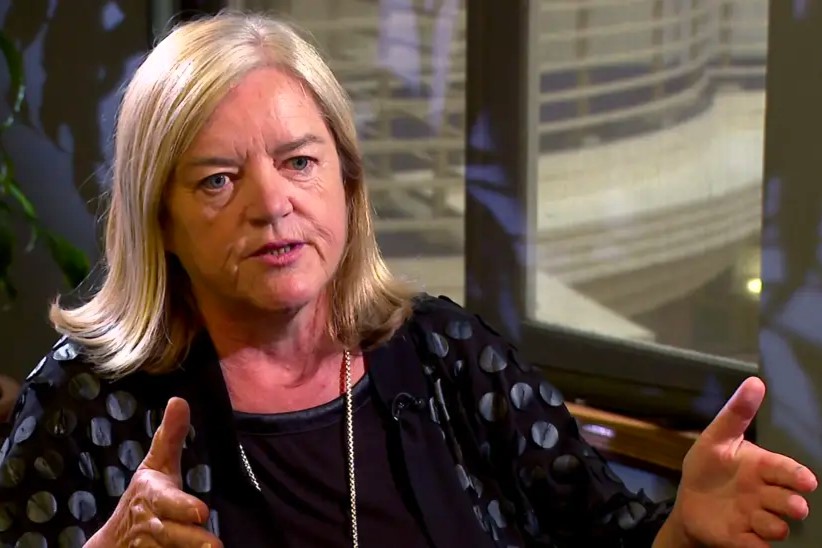 A woman talks in an interivew.
