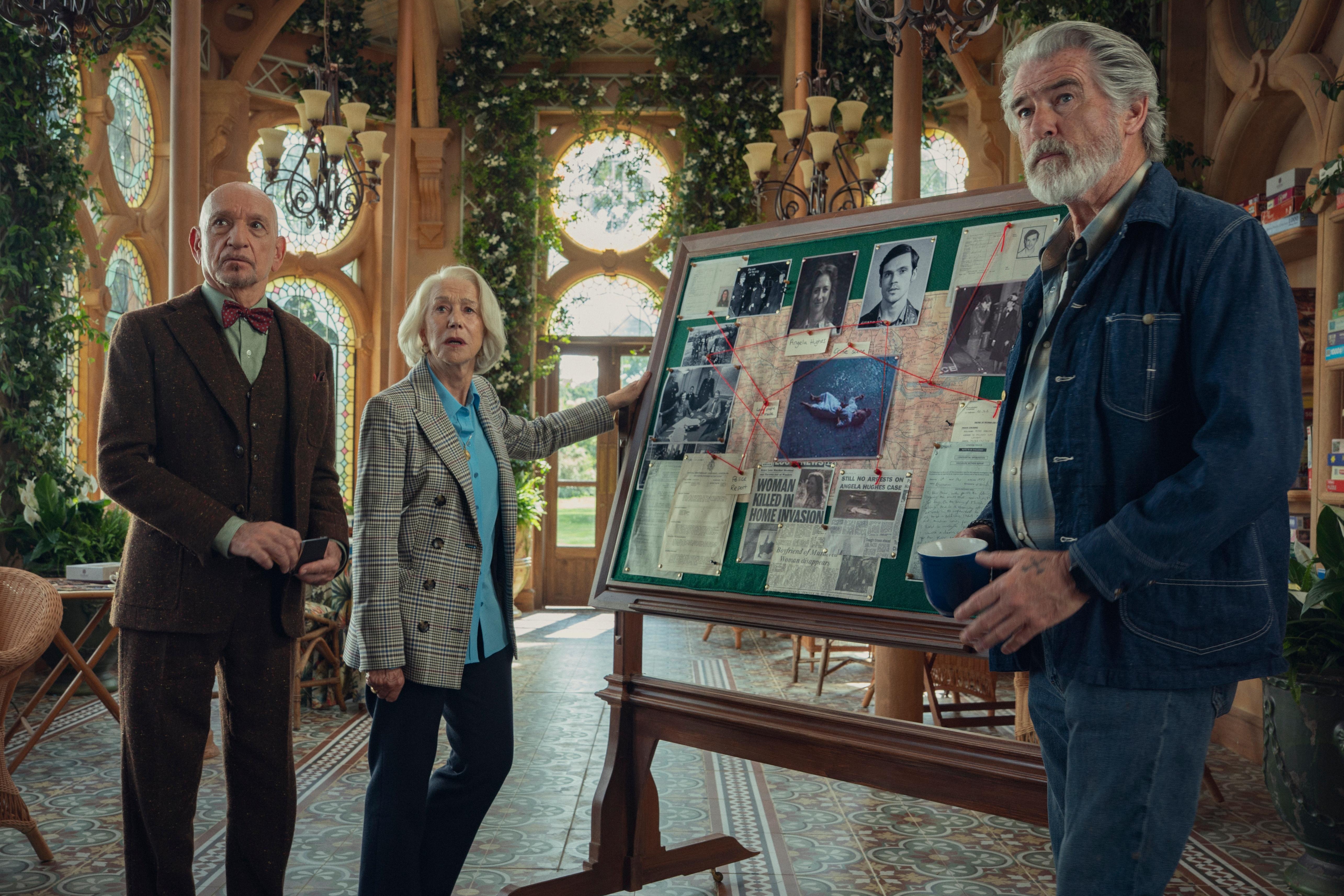 Elderly amateur sleuth stand by their pinboard.