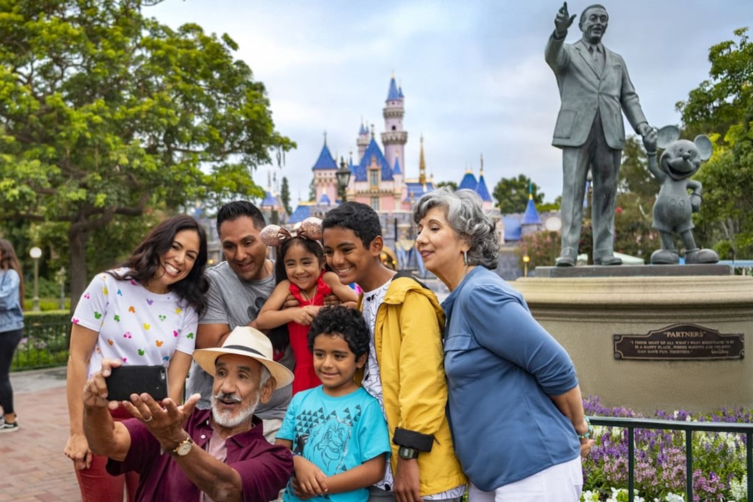 A family pose for a picture at Disneyland