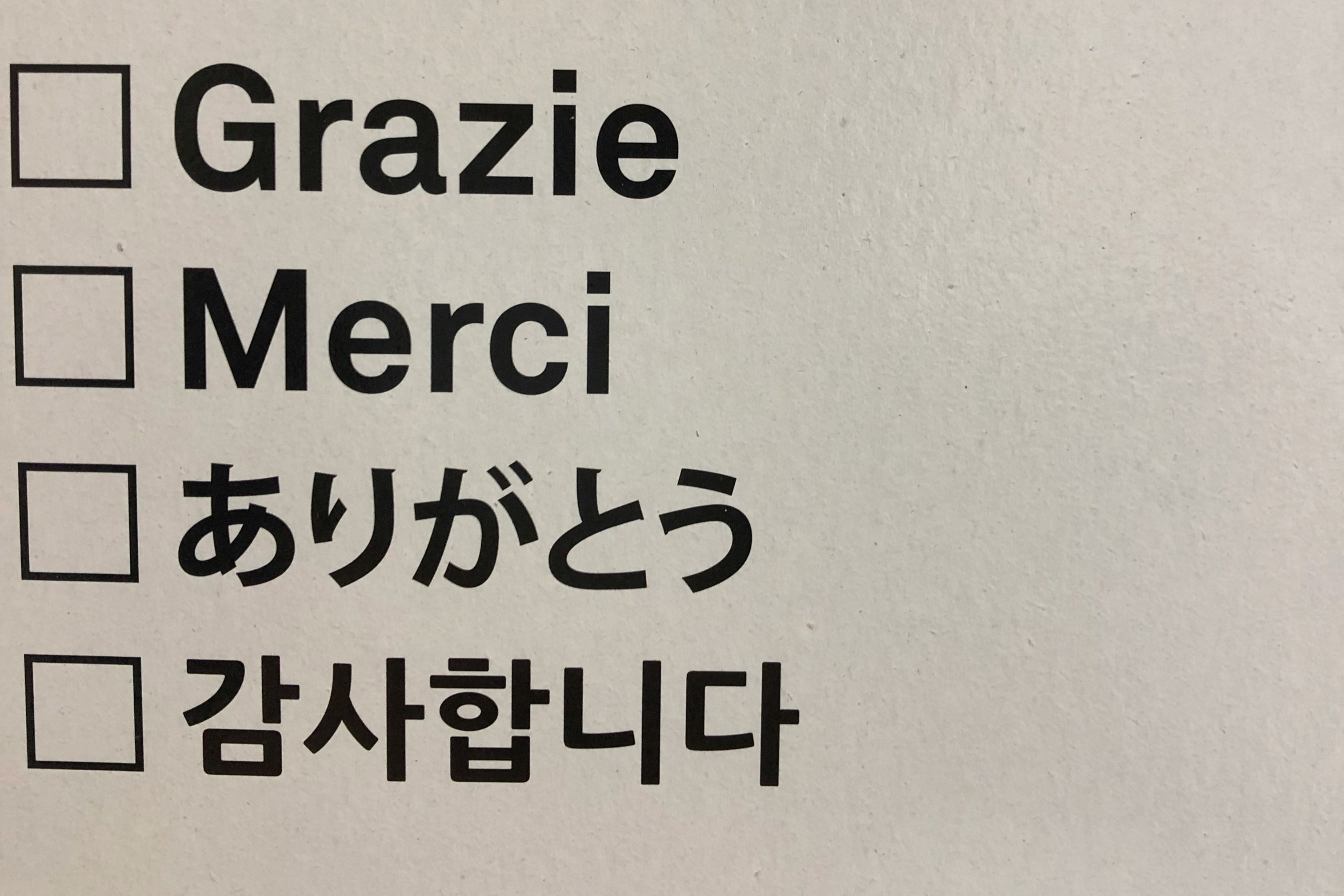 A check list shows 'thank you' in different languages.