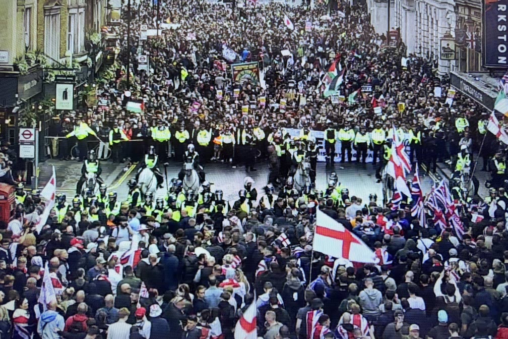 CCTV footage show two rival protests divided by a line of riot police.