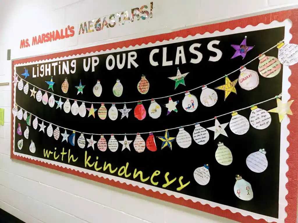 A classroom display of Christmas baubles under a banner.