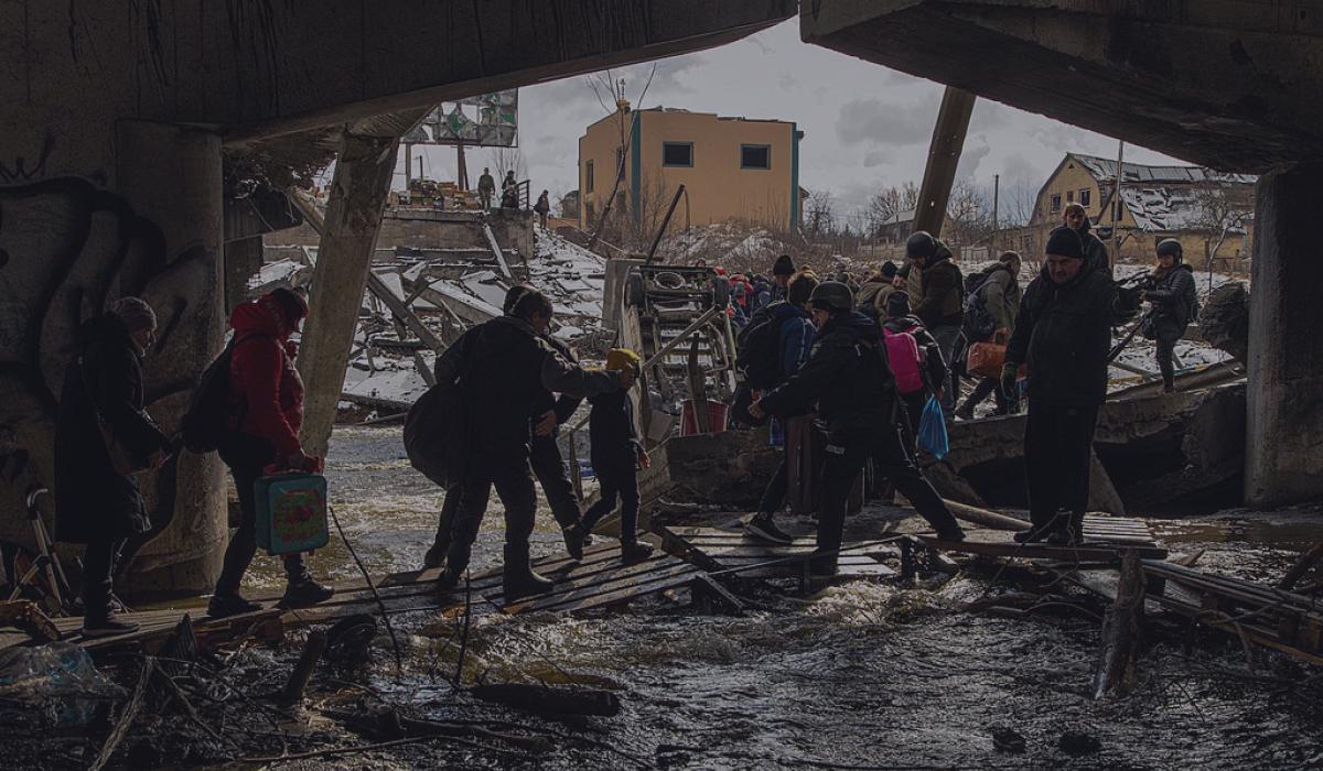 Civilian evacuation across Irpin River during the Ukraine War.