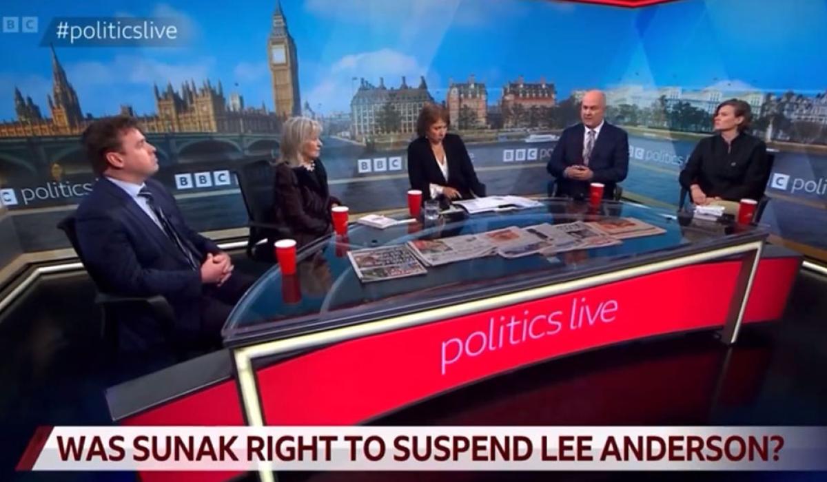 A TV roundtable discussion with five people against a backdrop of Parliament.