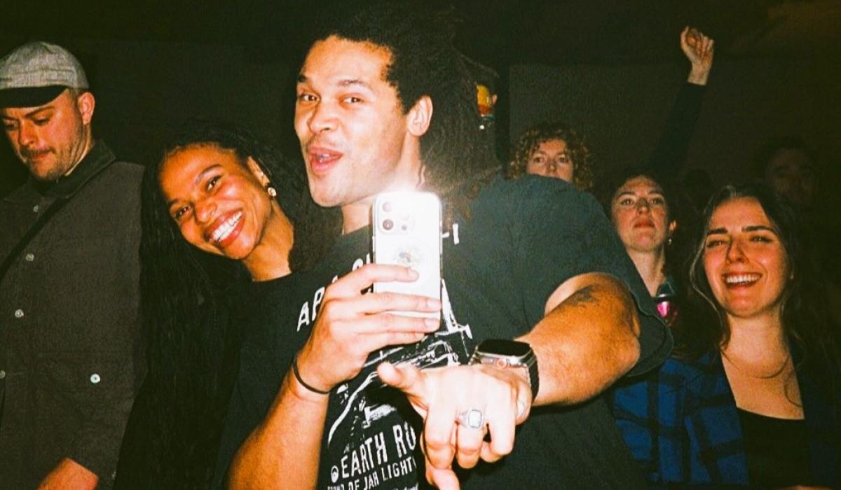 Ravers pose together for a selfie.
