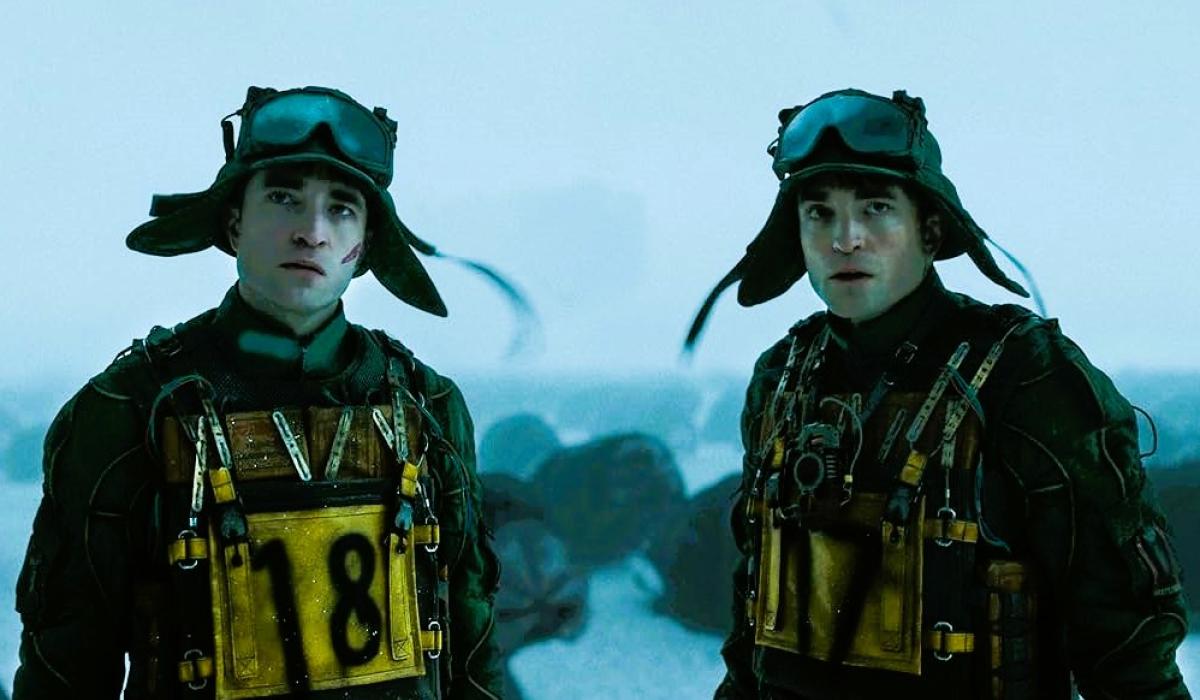 Two cloned humans stand side by side.