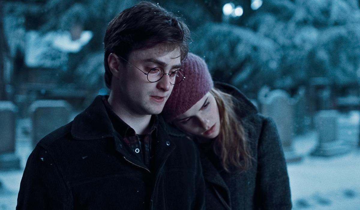 Hermoine rests her head on the shoulder of Harry Potter.