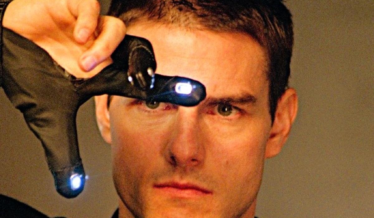 Tom Cruise gestures with his fingers in an e-glove in front of his face