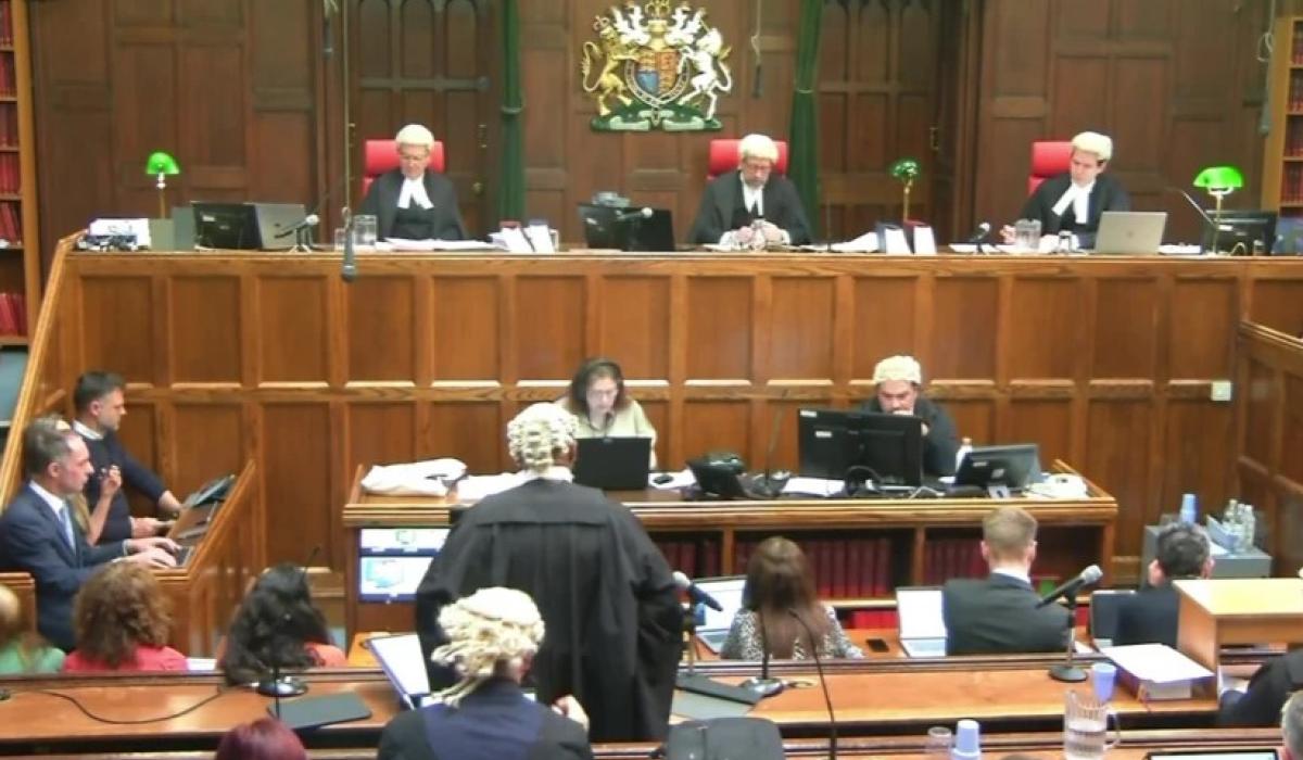 A court sits, with judges raised above the others.