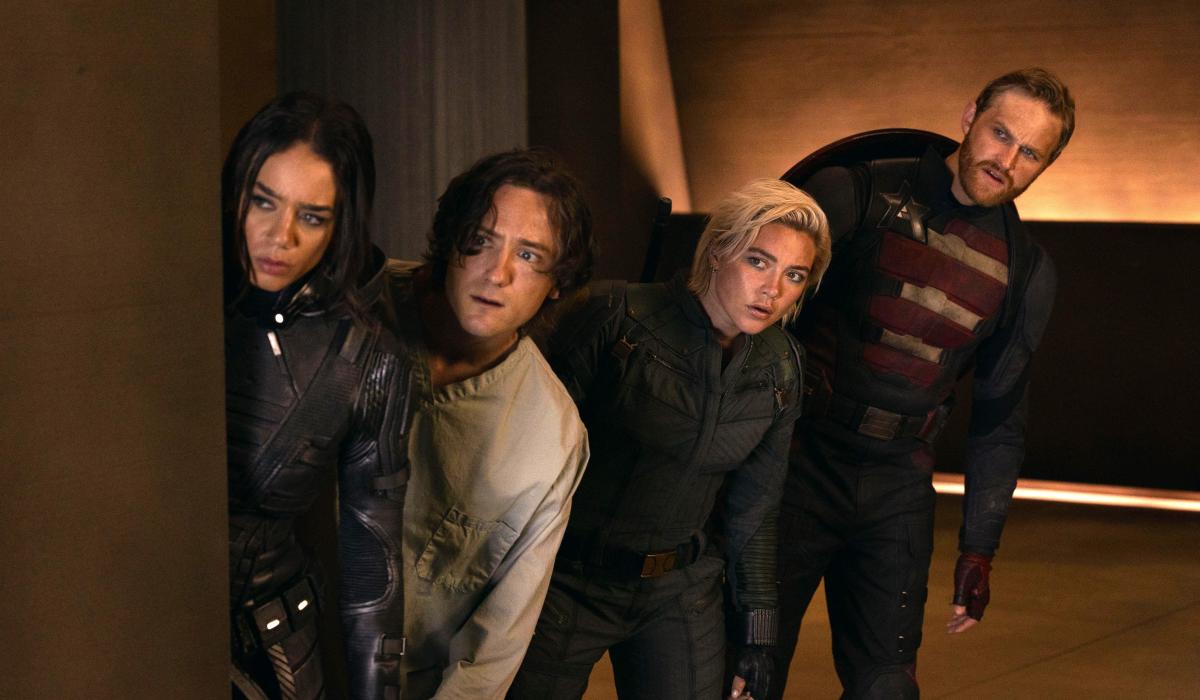 Four characters from a film loop warily to the side.