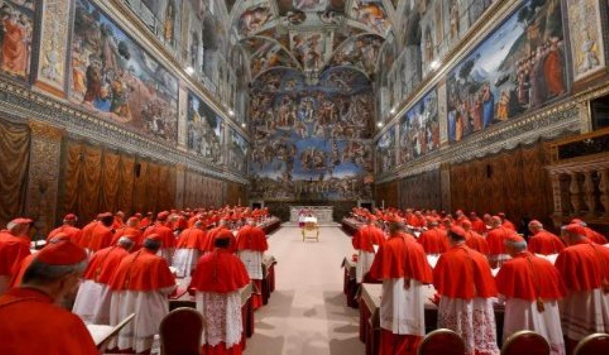 A gather of cardinals in the Sistene Chapel.