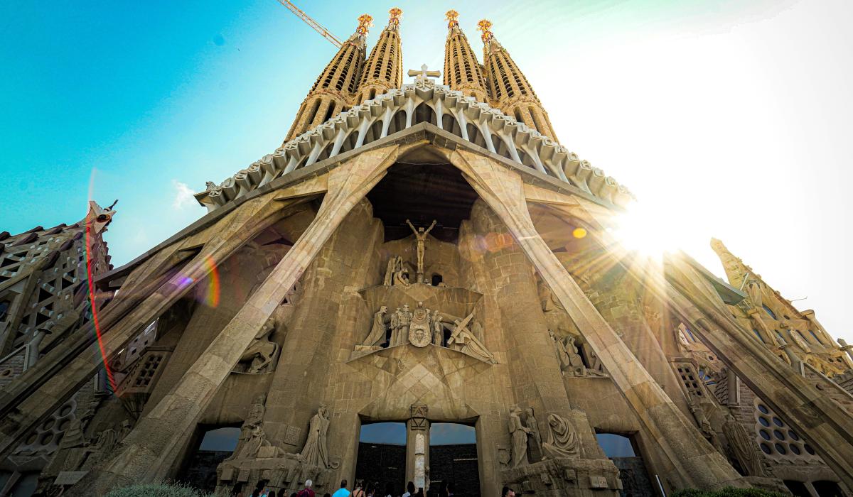 Looking up at the front of Gaudi's cathedra; as the sun comes out from behind the spires.
