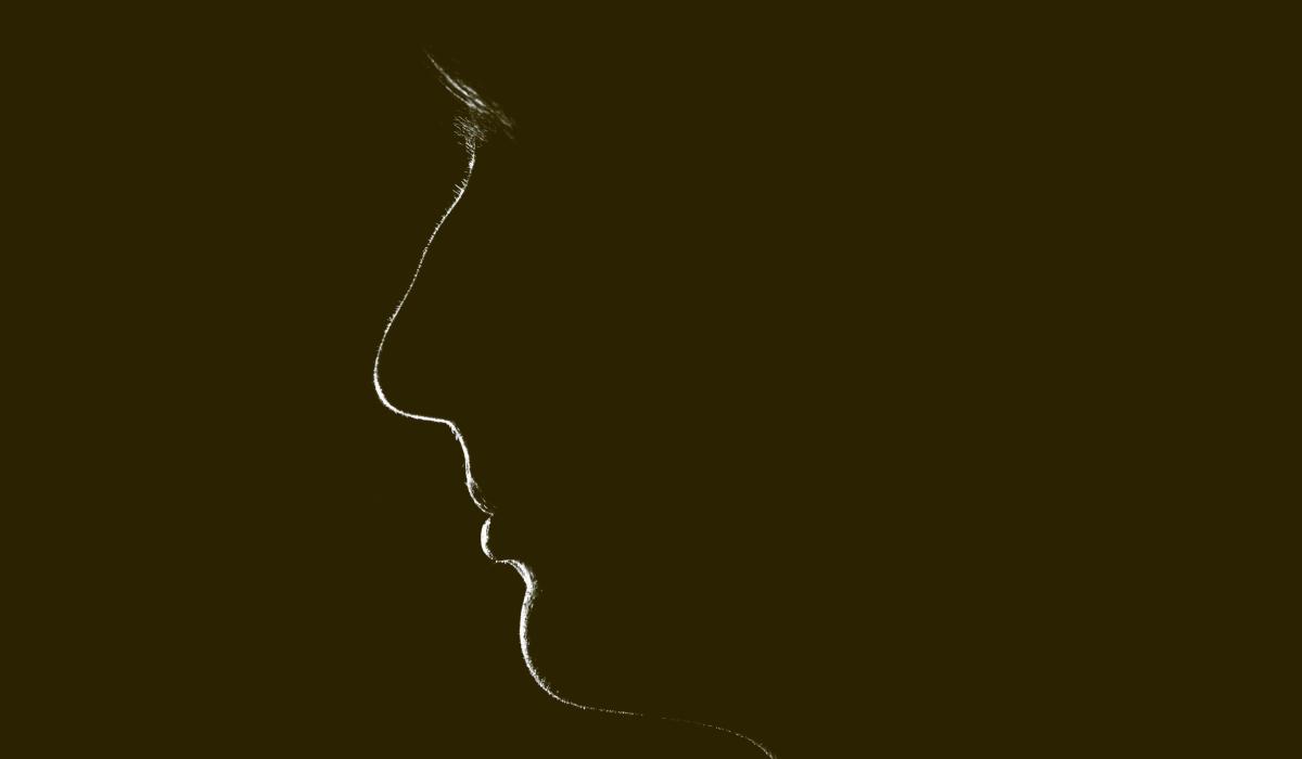 A silhouette of a woman's face.