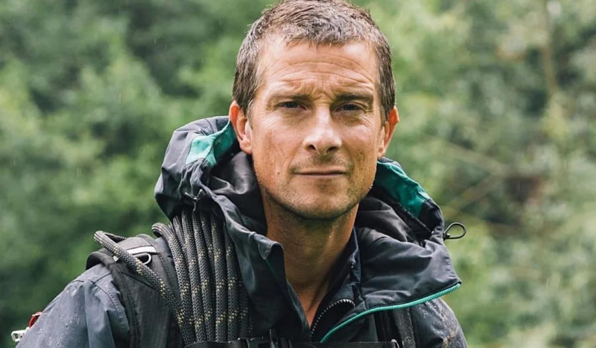 A wet-looking Bear Grylls looks at the camera.