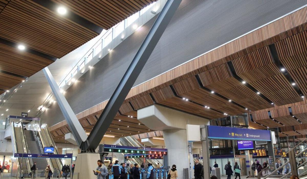 A station concourse with a light well above.