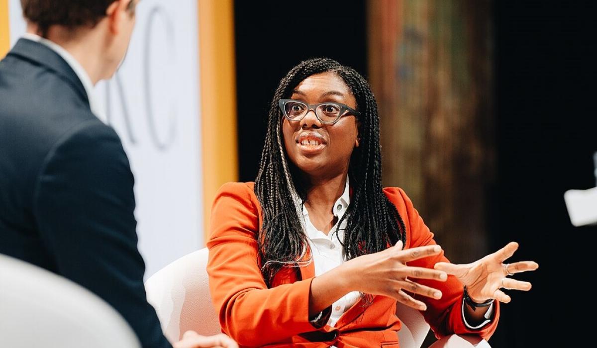Kemi Badenoch sits and talks.