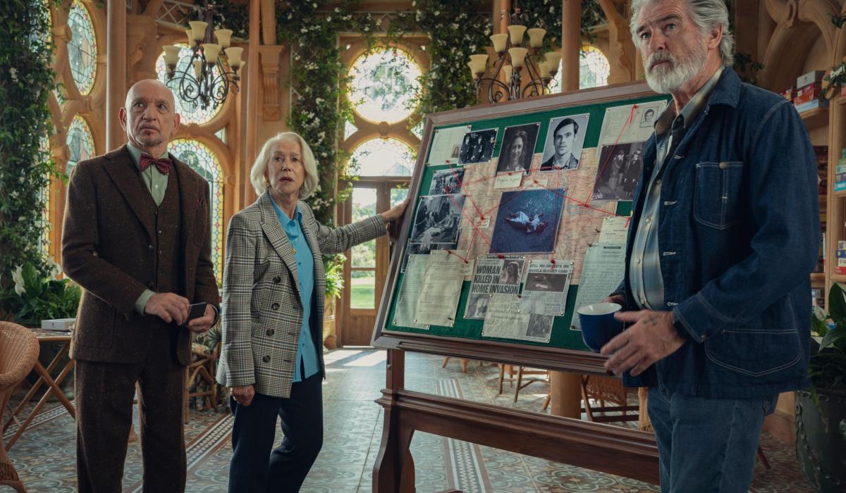 Elderly amateur sleuth stand by their pinboard.