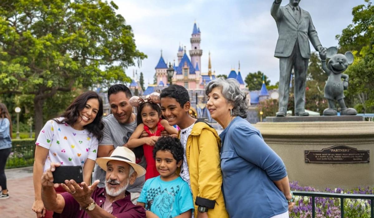 A family pose for a picture at Disneyland