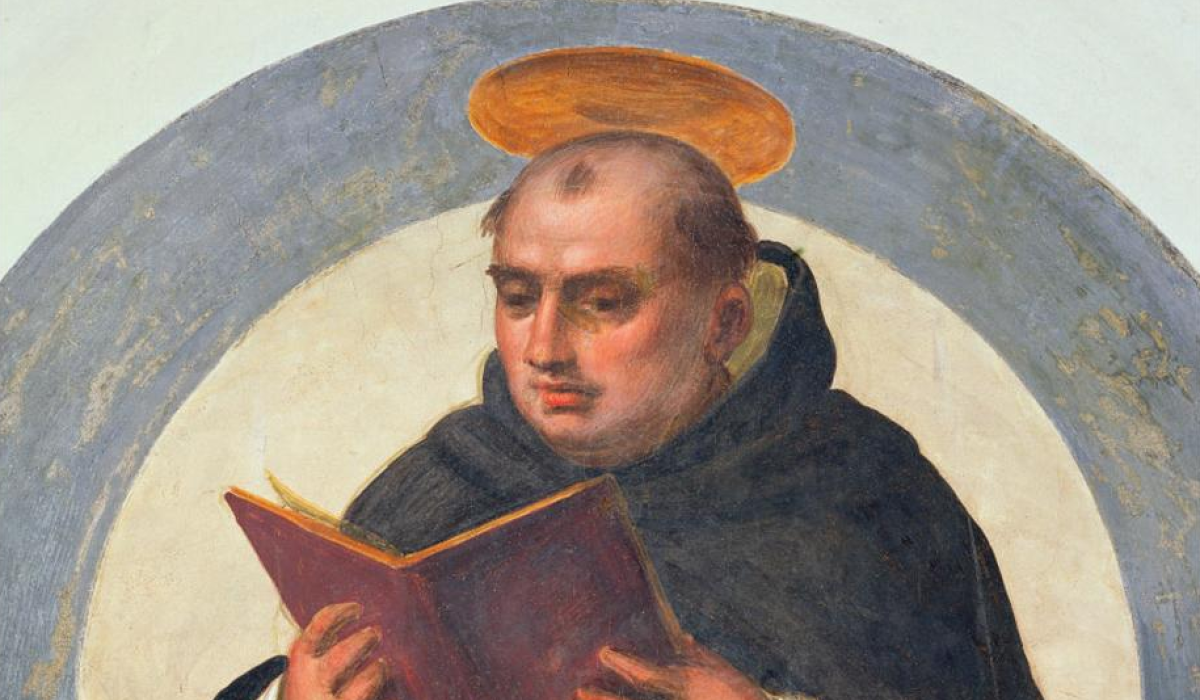 Thomas Aquinas reads.