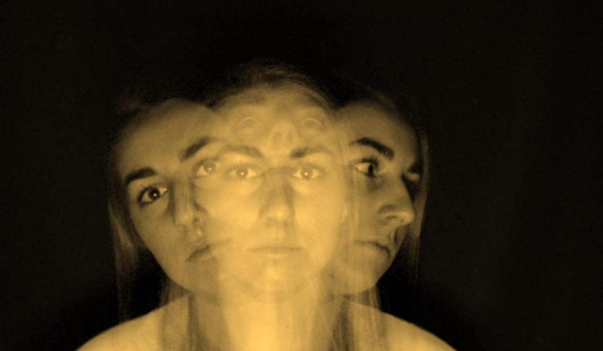 A multiple exposure image shows a womans head and shoulders looking ahead, to the sides and above.