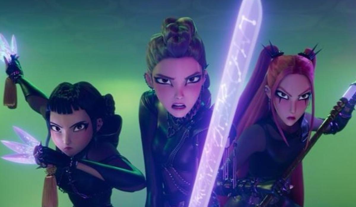 K-Popm Demon Hunters lean forward wielding weapons