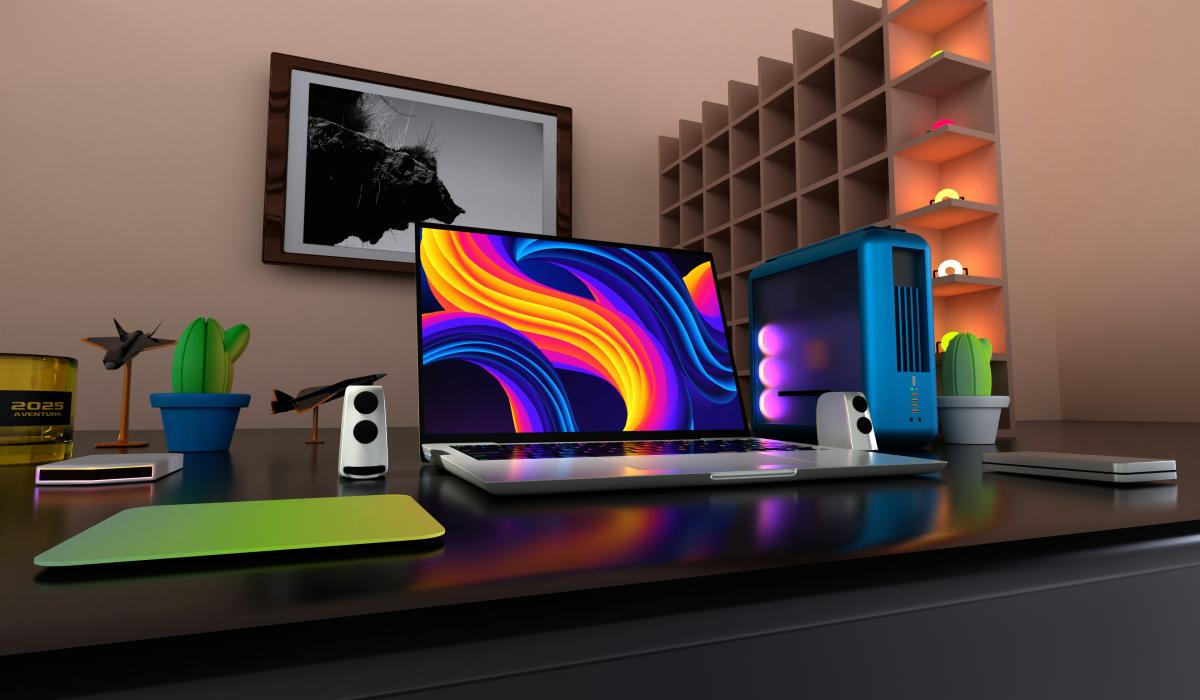 A flat screen on a desk displays a colourful pattern.