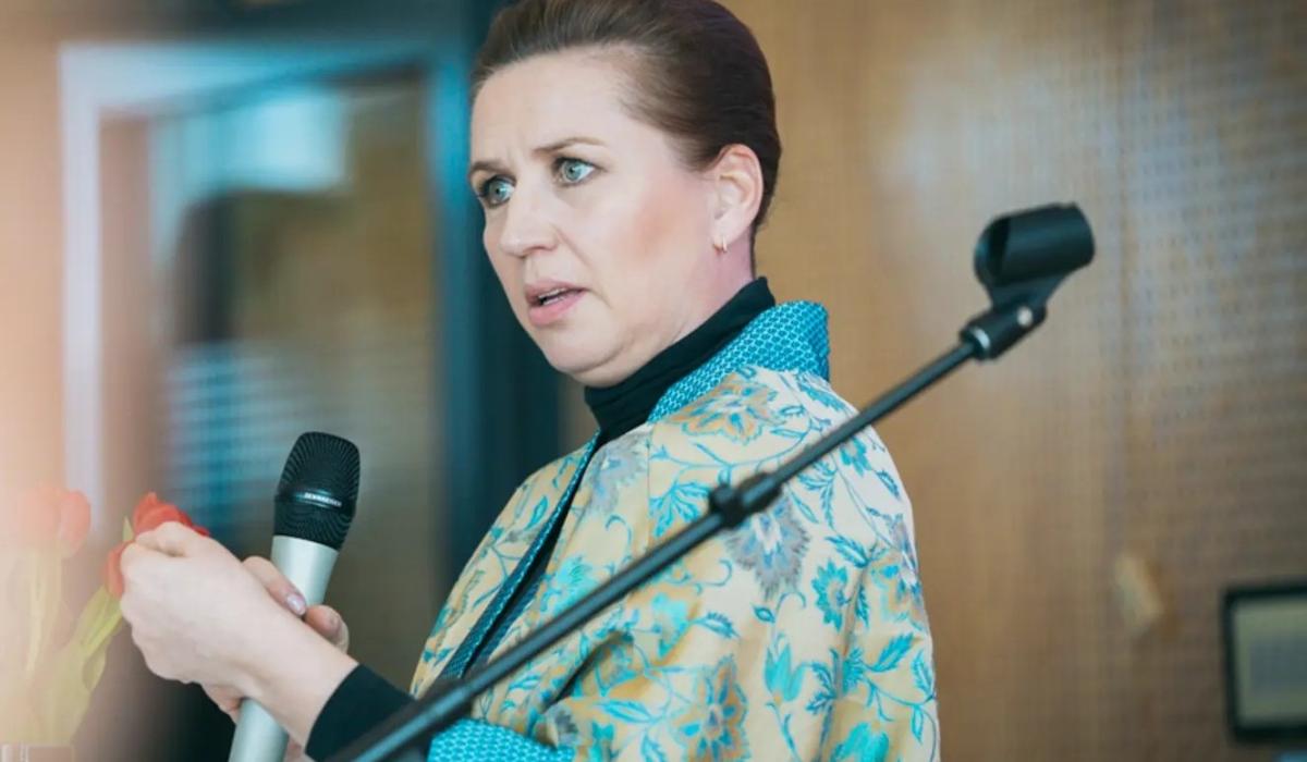 Mette Frederiksen gesture as she delivers a speech. 