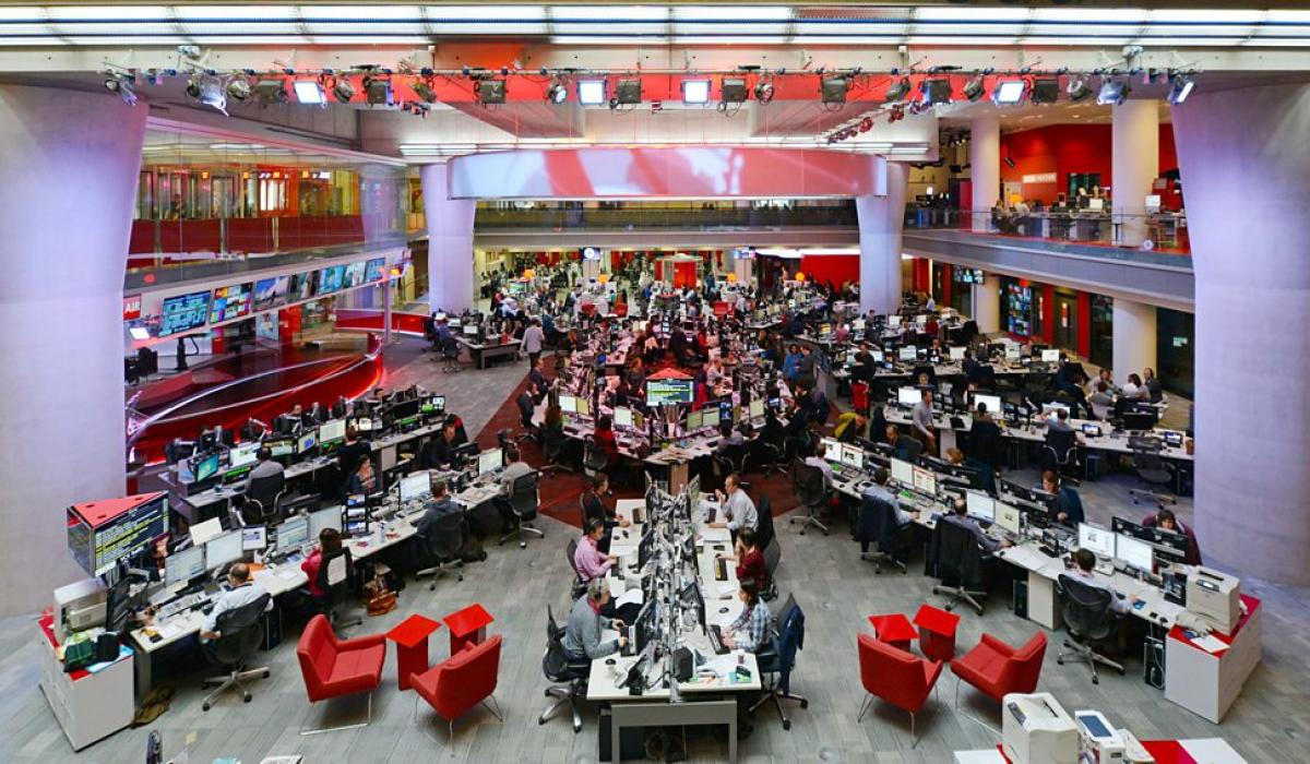 A wide angle view of the BBC newsrooms show a starm layout of desks