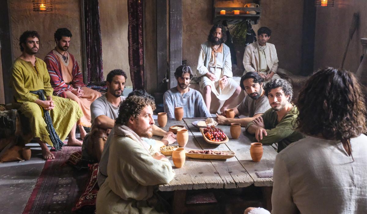 A still from The Chosen shows Jesus and the disciples around a table