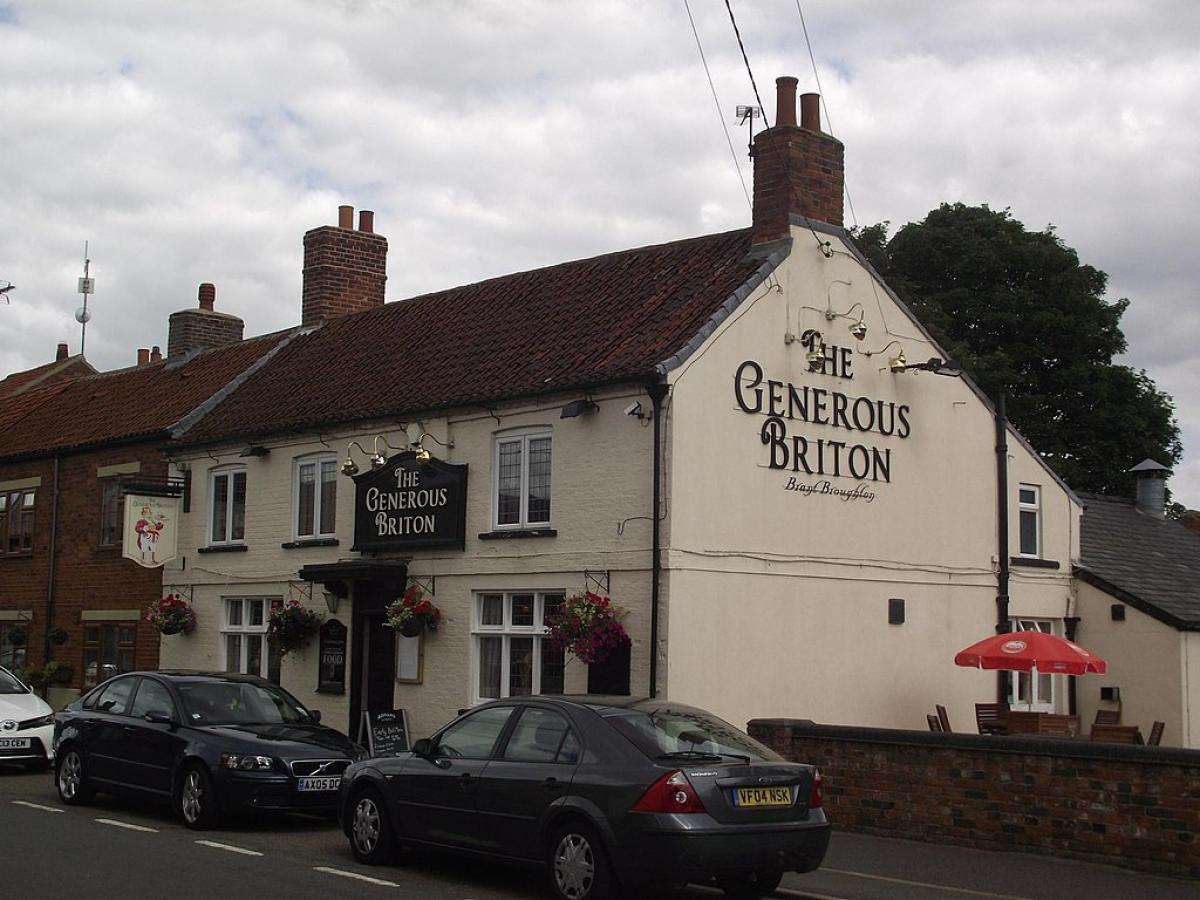 A village pub with its name on the gable end: The Generous Briton